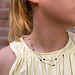 ZAG  Bijoux Dubbele goudkleurige ketting met zwarte facetkraaltjes