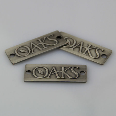 CombiCraft Voorbeeld van een logoplaatje in brons gegoten voor OAKS