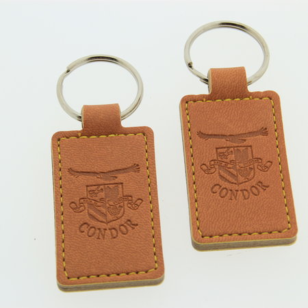 Leren of Kunstleren sleutelhangers 30x80mm met uw brandlogo.