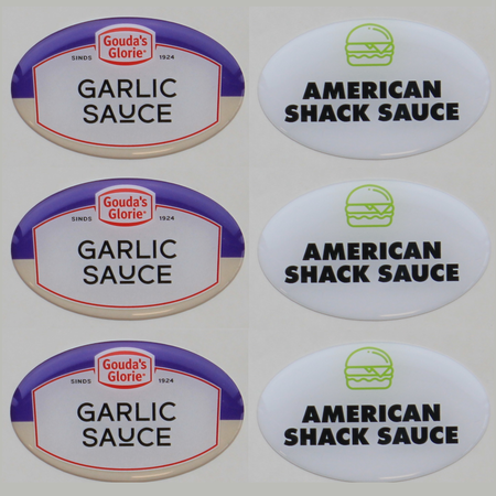 Domingstickers, stickers of logo's die bedekt worden door een laagje kunsthars.  Logoplaatjes voorzien van een laagje epoxy