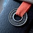 Gietlogo in metaal vanaf 100 stuks in kleinformaat, speciaal om aan stoffen kussens, gordijnen, karpetten of meubels te bevestigen.