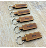 Sleutelhanger van leer of kunstleer 23x95mm met tekst of nummering zwart gedrukt - per 1 stuk