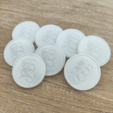 Plastic reliëfmunten Ø29mm met jouw ontwerp - per 1000 stuks