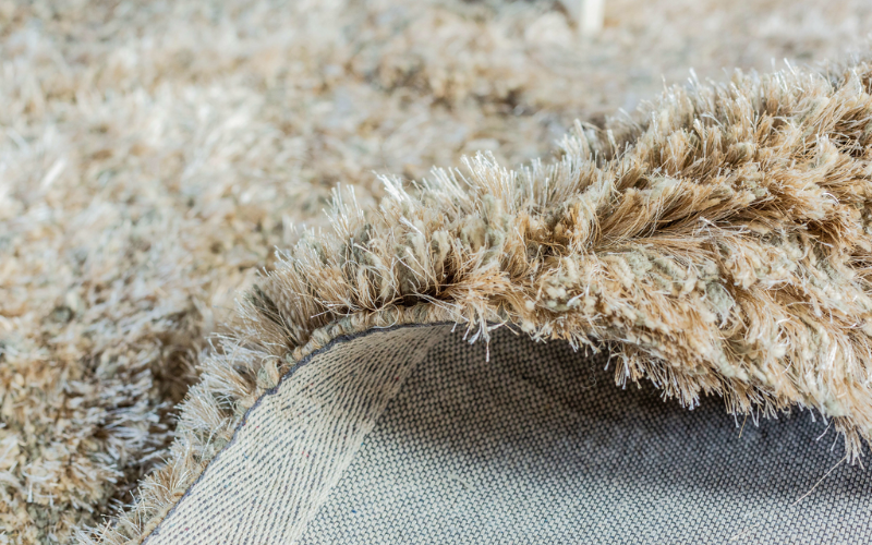 Close-up foto tufting bij vloerkleed Dime