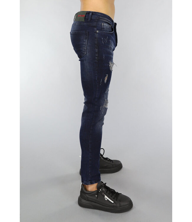 Donkerblauwe Jeans met Vintage Wash en Gaten