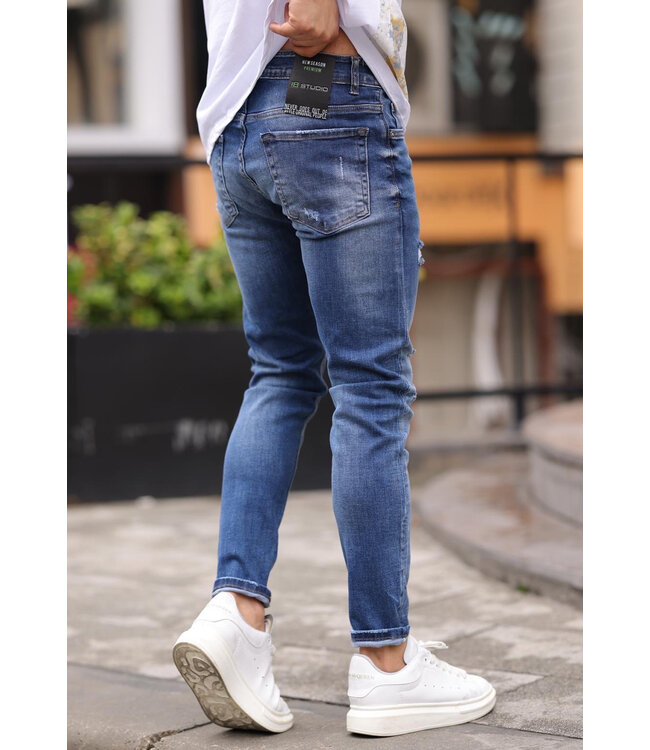 Slim Fit Middenblauwe Jeans met Subtiele Scheuren en Stretchstof voor Heren
