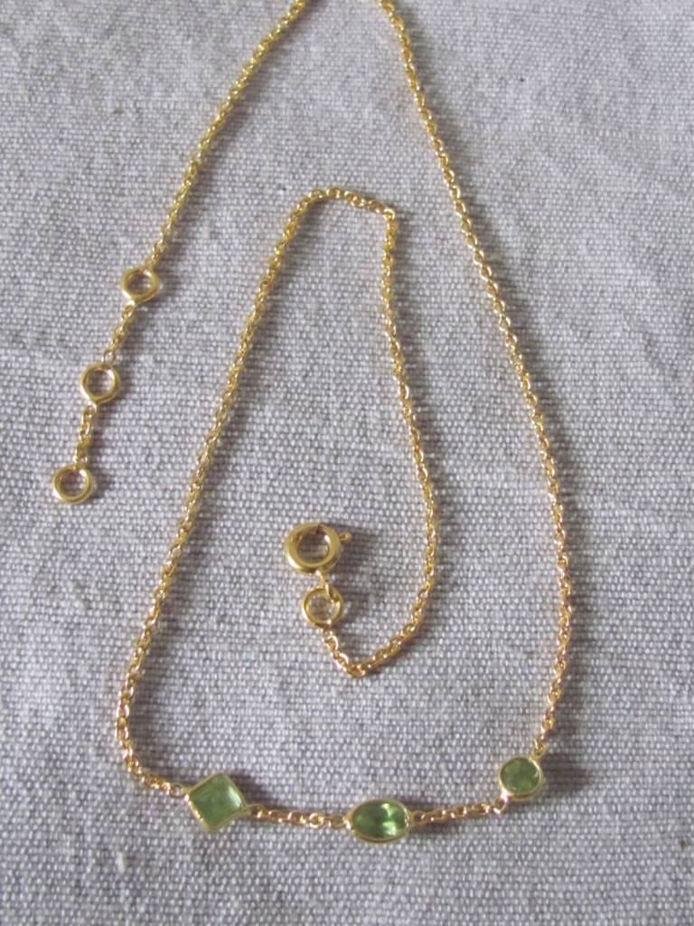 Necklace gold on silver and peridot stones