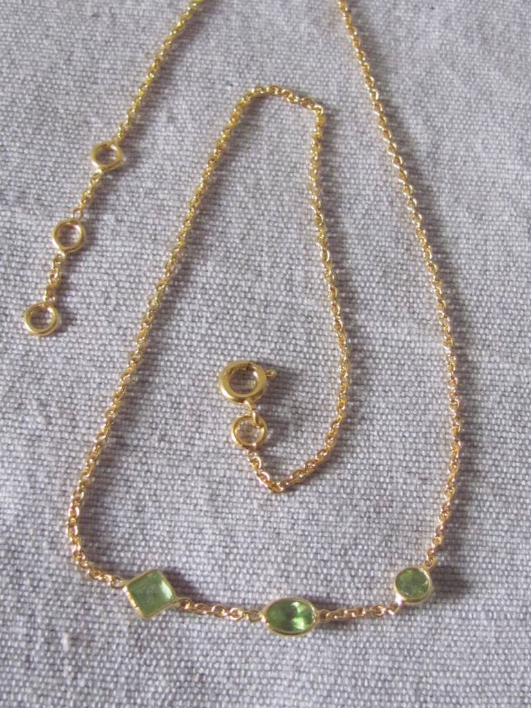 Necklace gold on silver and peridot stones