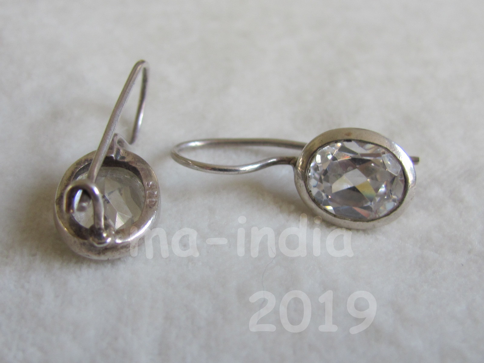 Silver earring,  dormeuse  model  with oval zircon