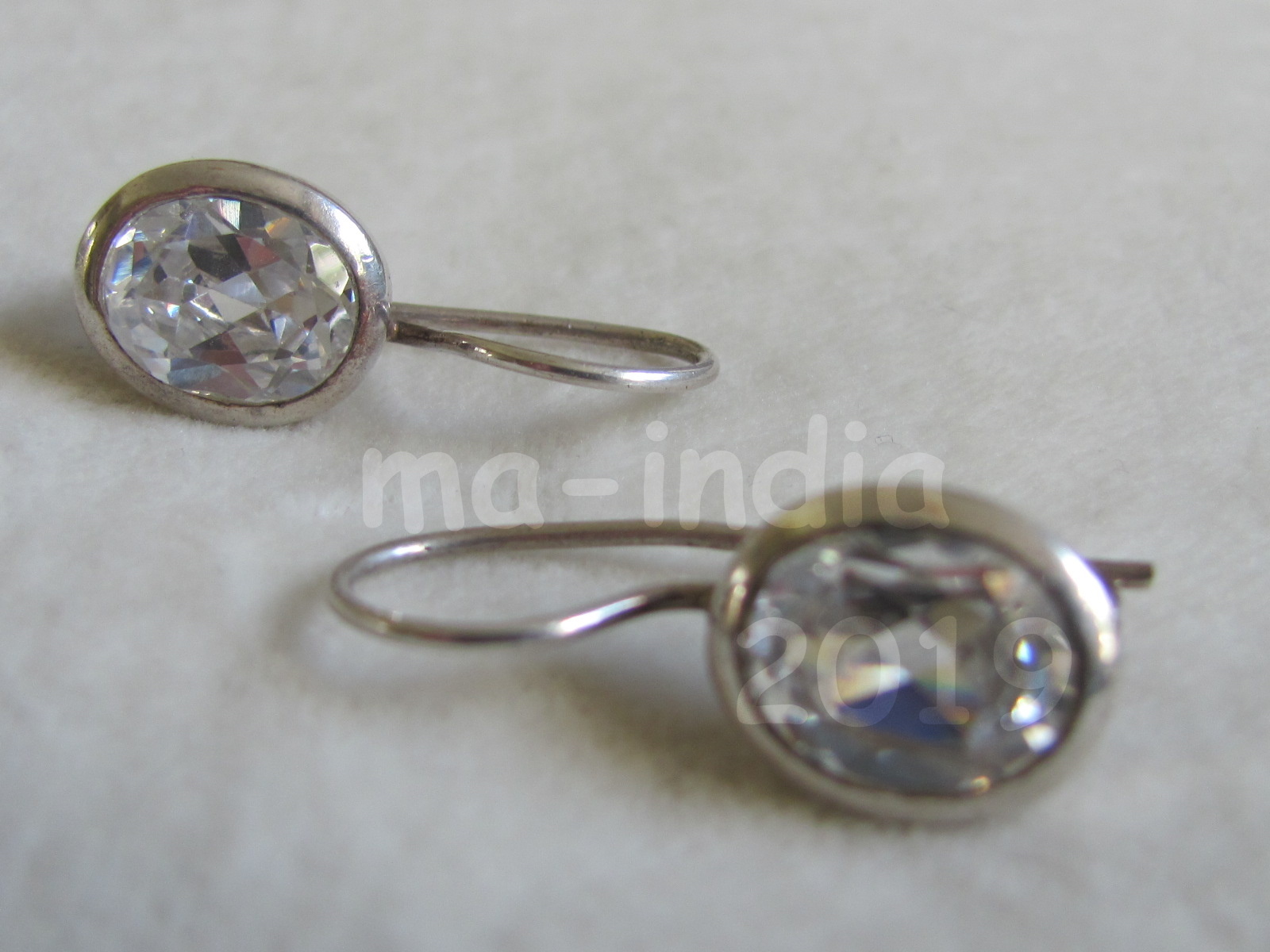 Silver earring,  dormeuse  model  with oval zircon