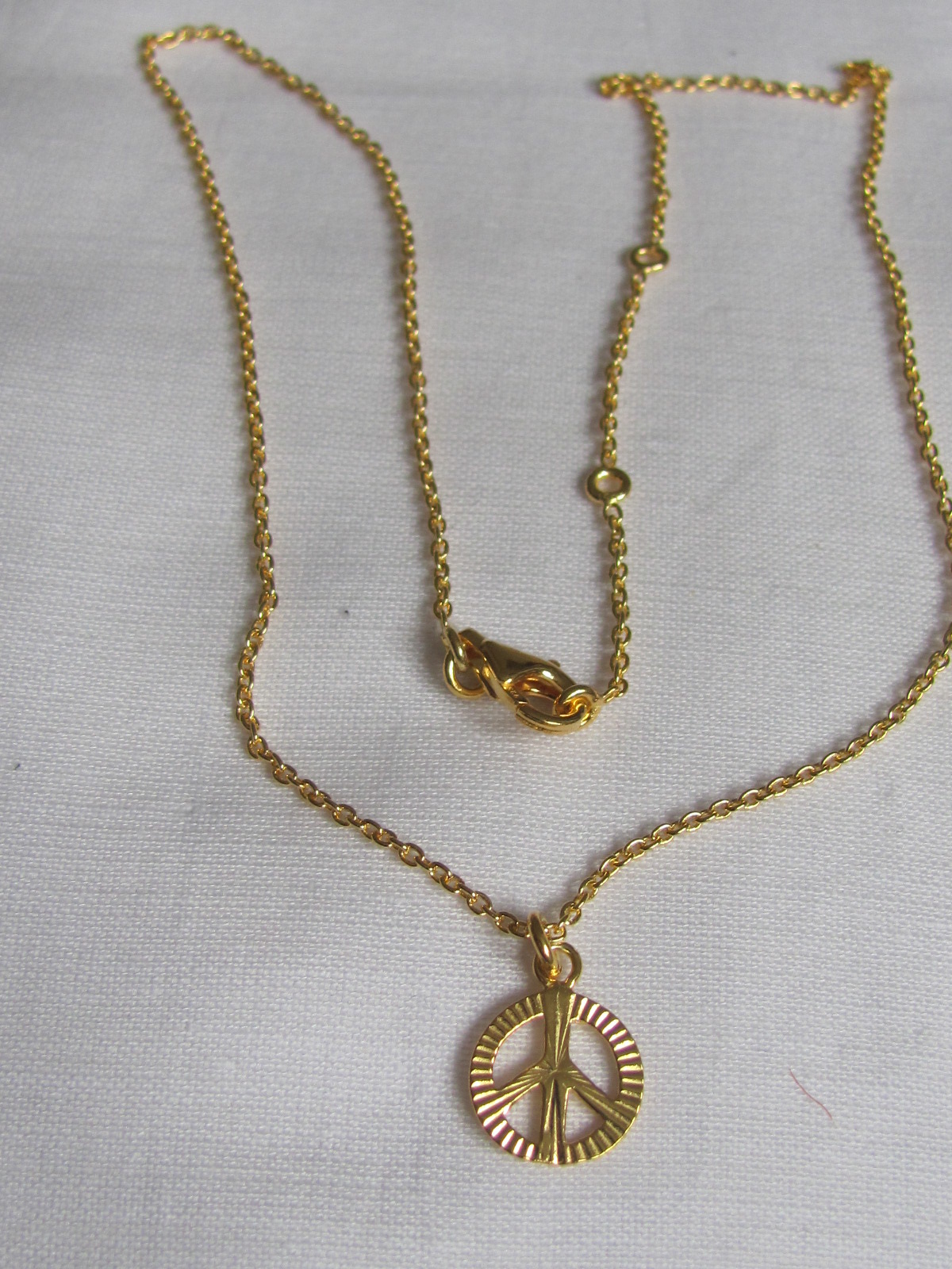 Necklace gold on silver with peace pendant charm