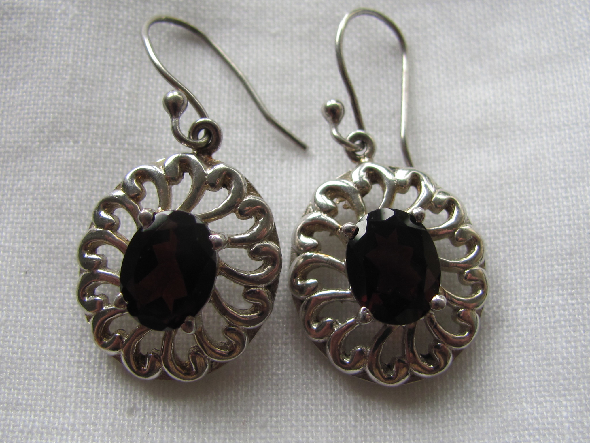 Earrings silver with hand faceted garnet stone