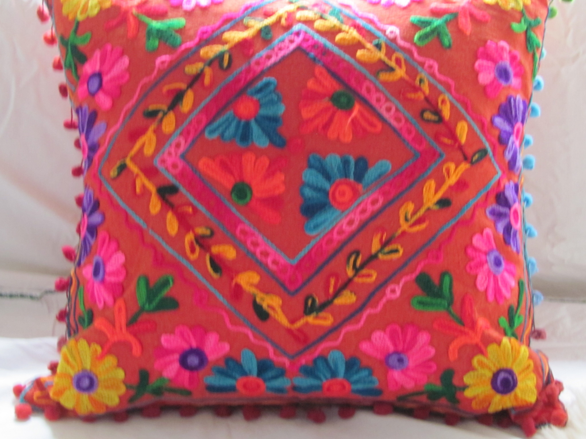 cushion cover susani embroiderd in Uzbeki style  brickred ground