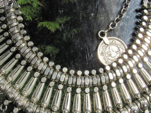 Necklace, white metal tribal style with coins and hand made green glass beads