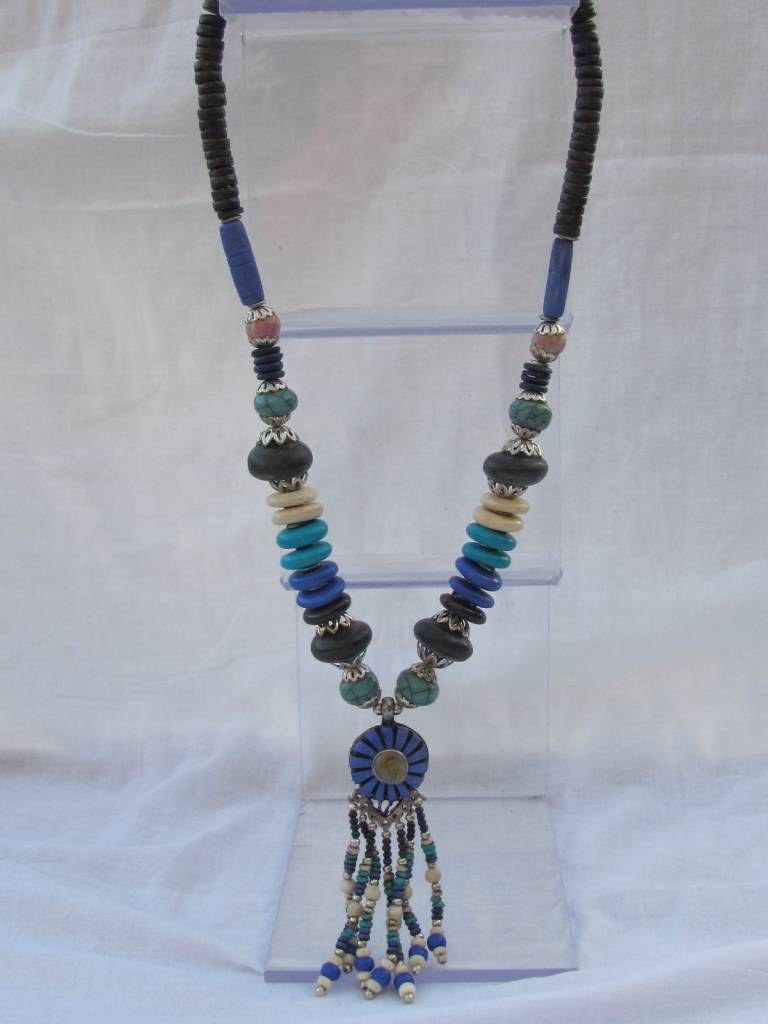 Necklace with beaded tassel and blue medallion