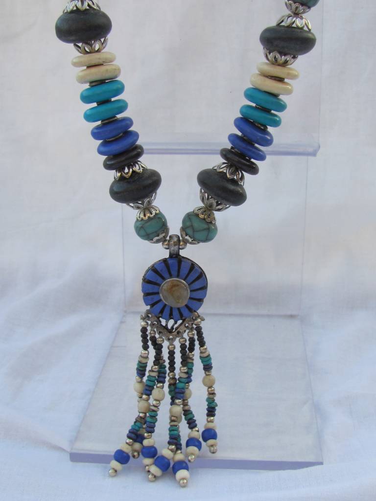 Necklace with beaded tassel and blue medallion