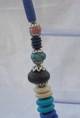 Necklace with beaded tassel and blue medallion