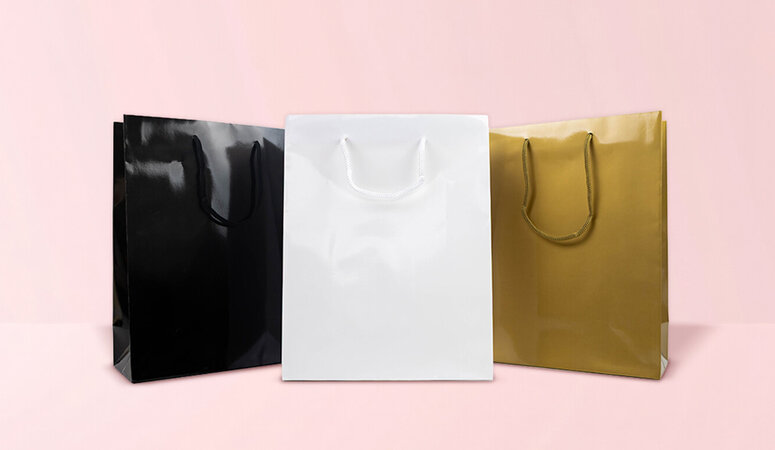Luxe papieren tassen: welke soorten en handvatten passen bij jouw merk?
