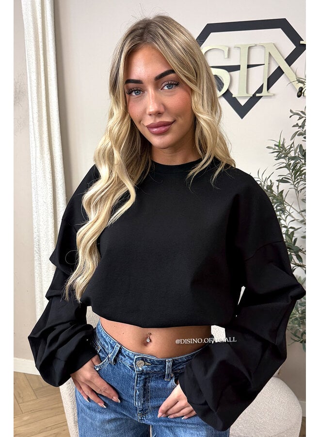 BLACK - ‘SOLÈNE SWEATER’ – OVERSIZED LAYERED RUFFLE SLEEVE SWEATER