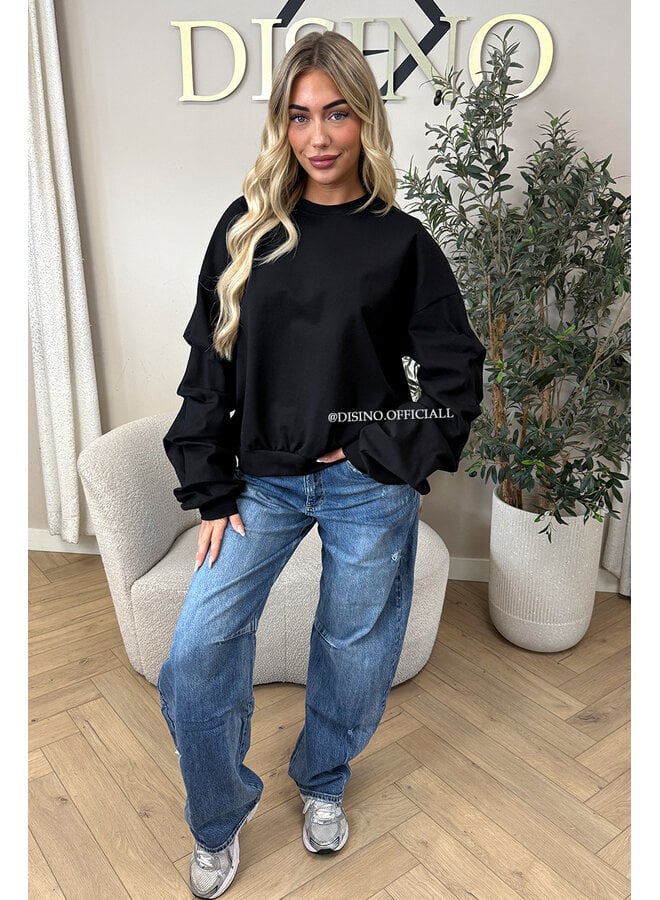 BLACK - ‘SOLÈNE SWEATER’ – OVERSIZED LAYERED RUFFLE SLEEVE SWEATER