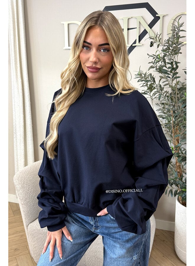 NAVY BLUE - ‘SOLÈNE SWEATER’ – OVERSIZED LAYERED RUFFLE SLEEVE SWEATER