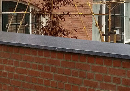 Muurafdekker geschuurd