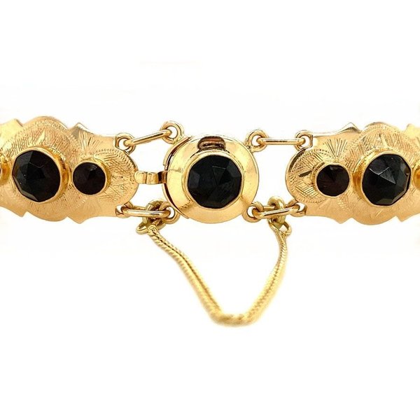 Gold bracelet with garnet 14 krt