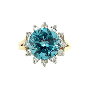 Gold entourage ring with diamond and blue zircon 14 crt