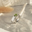 White gold ring with peridot and diamond 14 kt