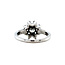 White gold entourage ring with 14 carat diamond