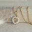 Gouden hart hanger met zirkonia 14 karaat
