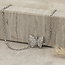 Witgouden armband met zirkonia vlinder 18 karaat