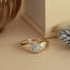 Gold entourage ring with 14 carat diamond