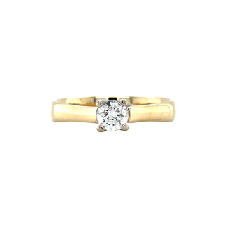 Gold solitaire ring with 14 carat diamond