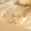 Bicolour gouden oorstekers met diamant 18 krt
