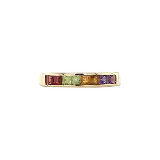 Gold ring with colored stone