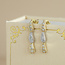 Gouden oorstekers met hanger en diamant 14 karaat