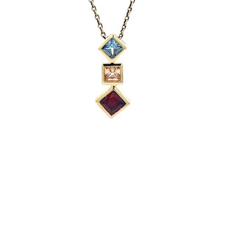 Gold pendant with colored stone