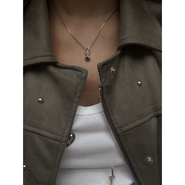 14 karat gold pendant with colored stone