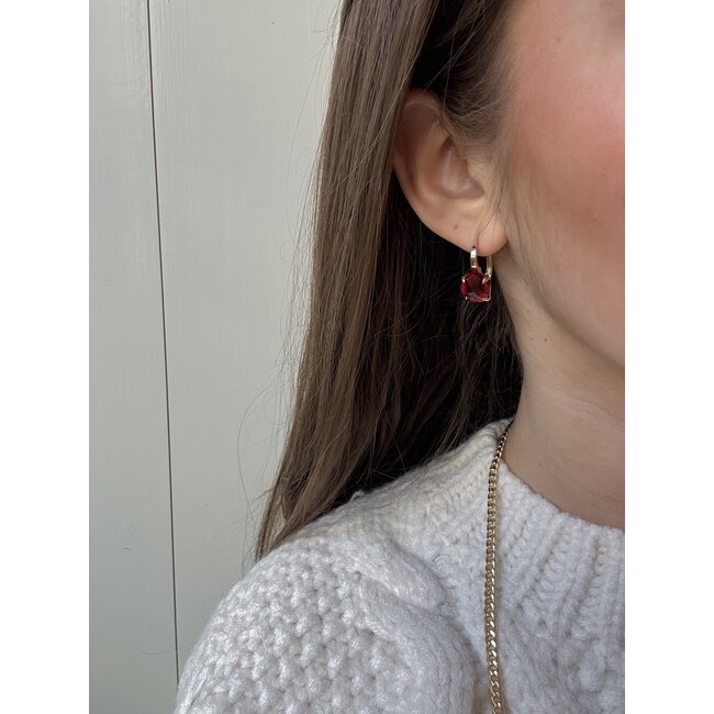Gold ear jewelry with red gemstone 18 karat