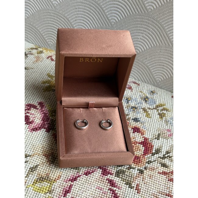 White gold hinged hoop earrings from Bron Jewelry 14 karat