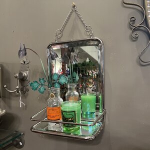 Small mirror with foldable shelf