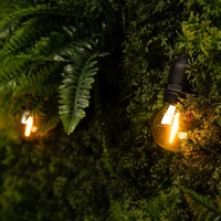 Ledvion 15m LED Lichterkette + 3m Anshlusskabel - E27 - 2100K - IP65 - Verknüpfbar - inkl. 15 LEDs - Geeignet für den Innen- und Außenbereich