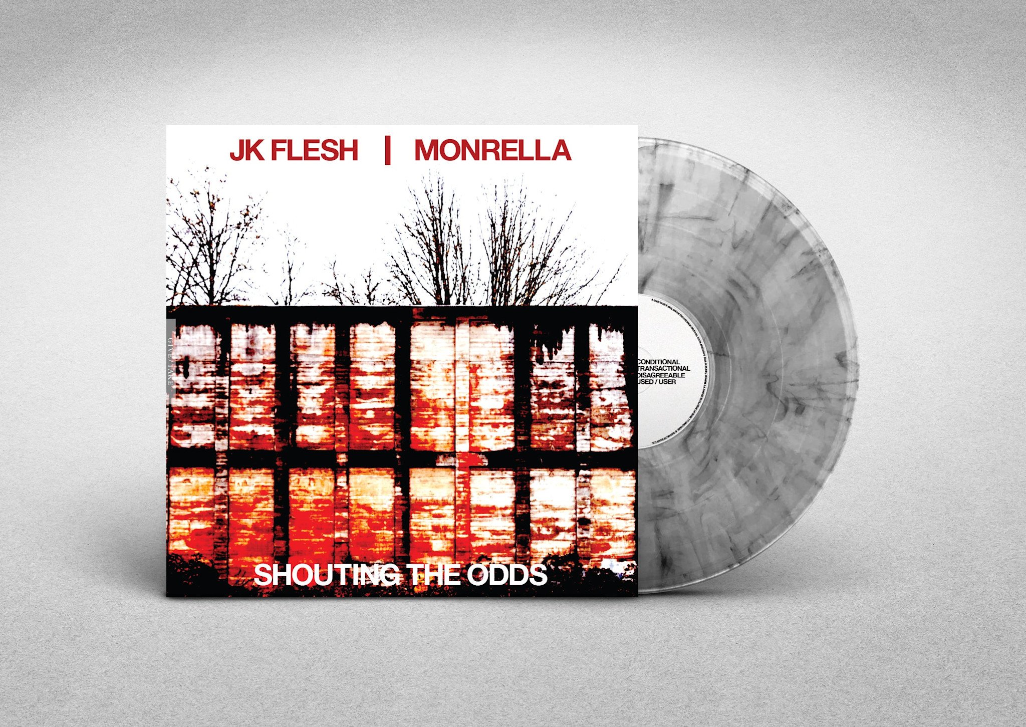 JK FLESH / MONRELLA - SHOUTING THE ODDS (Clear Smoke Vinyl)