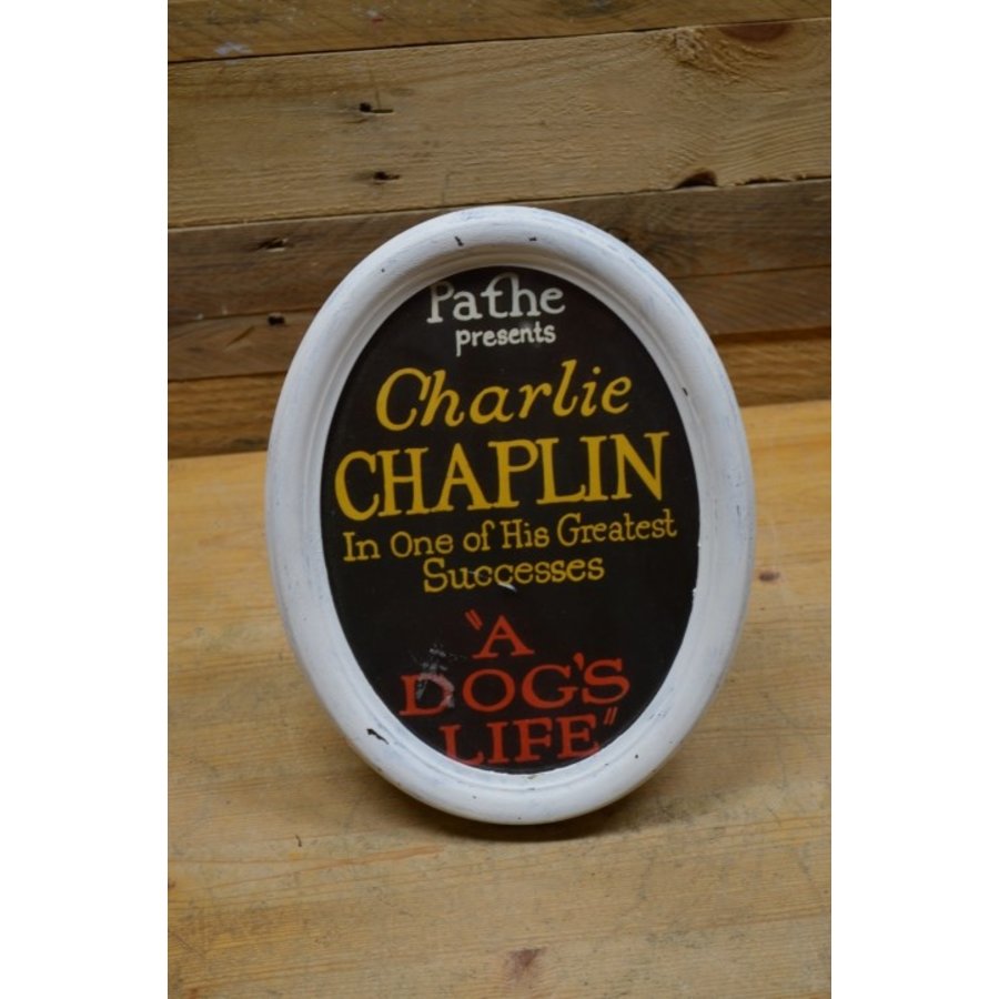 Rond wit lijstje met Charlie Chaplin reclame-1