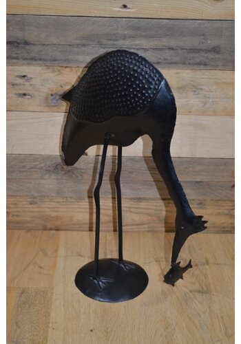 Metalen vogel met vis 