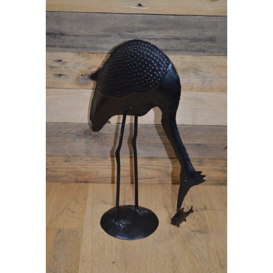 Metalen vogel met vis-1