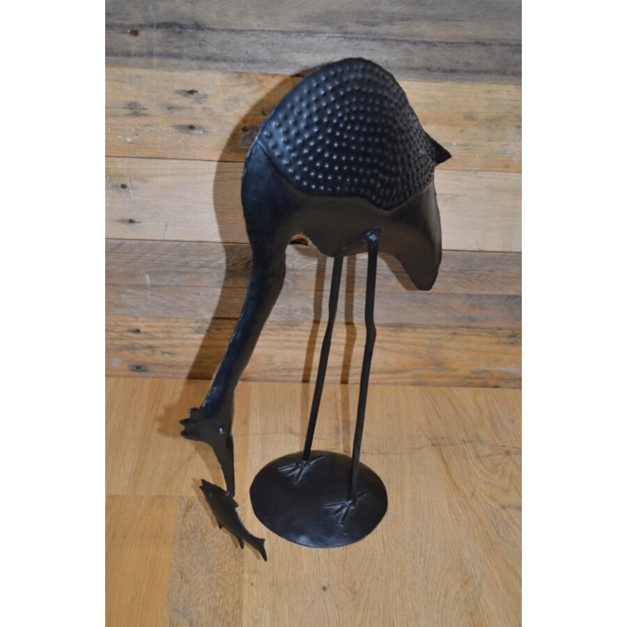 Metalen vogel met vis-3