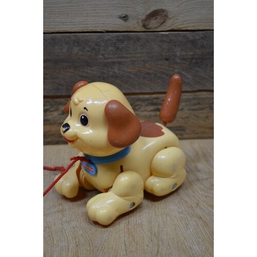 Vintage trekhondje aan een koord 
