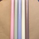 A package with 10 pastel coloured candles